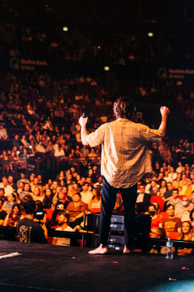 Matt Corby tried to get the seated crowd as fired up as they were allowed to be.