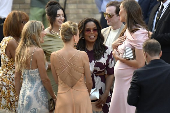 Oprah Winfrey, centre right, arrives in Venice for the wedding.