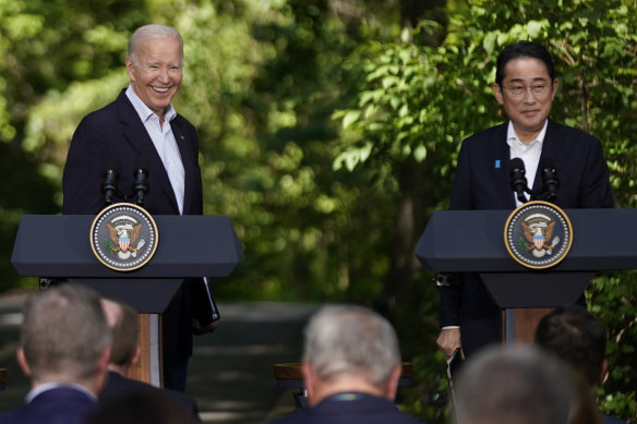 “I’m happy”: President Joe Biden smiles as he stands next to Japanese Prime Minister Fumio Kishida.