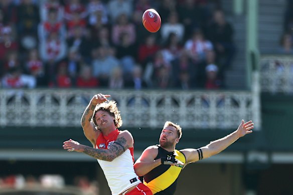Peter Ladhams competes with Noah Balta for a high ball.