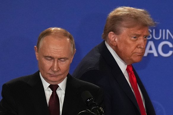 Vladimir Putin and Donald Trump arrive for their press conference in Alaska.