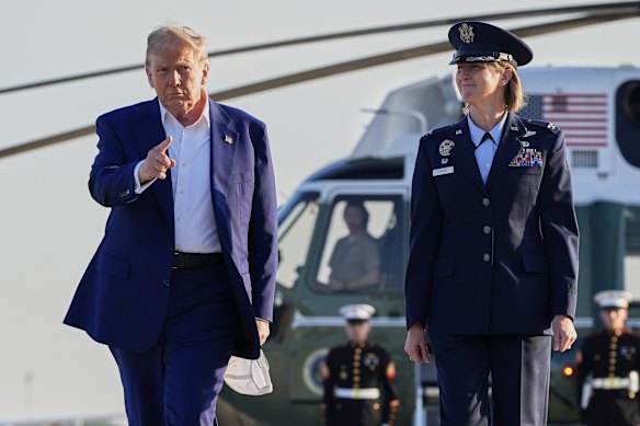 US President Donald Trump makes his way to board Air Force One. 