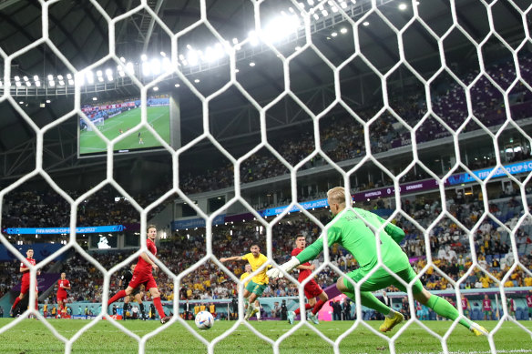 Mathew Leckie fires the ball out of the reach of Danish keeper Kasper Schmeichel.