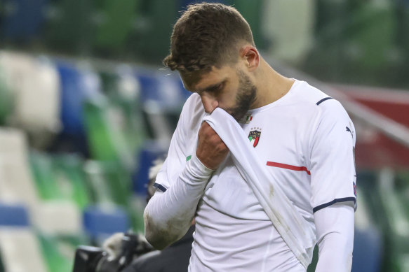 Domenico Berardi heads off the field after Italy missed direct qualification for the World Cup.
