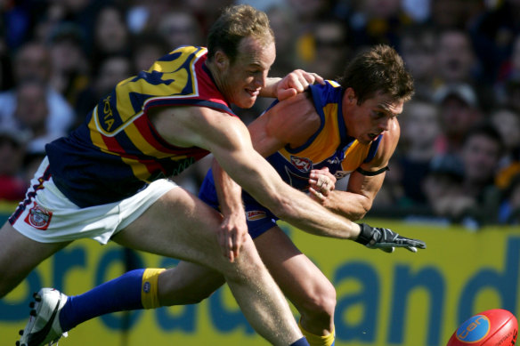 Ben Cousins battles with Adelaide’s Ian Perrie.