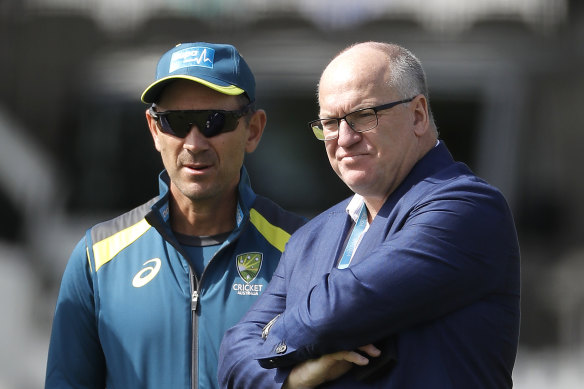 Justin Langer with Cricket Australia chairman Earl Eddings (right).