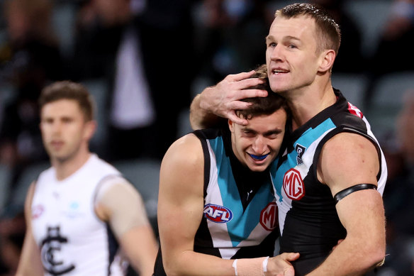 Filling your boots: Orazio Fantasia and Robbie Gray celebrate a goal.