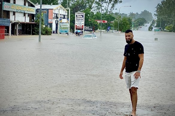 Omid Mehrzadi outside his flooded Oxley business.