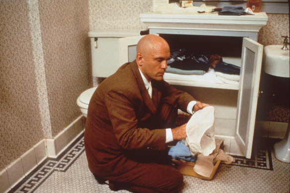 John Malkovich finds strangers entering a portal into his brain in <i>Being John Malkovich</i>.