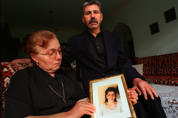 Christina and George Halvagis hold a picture of their murdered daughter, Mersina.