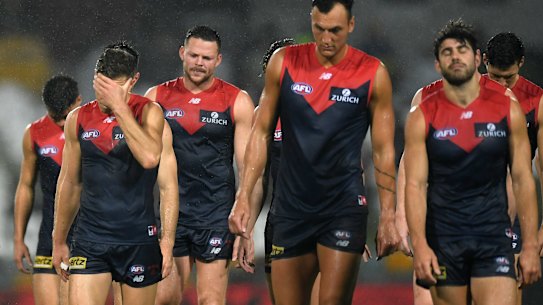 CAIRNS, AUSTRALIA - SEPTEMBER 07: Melbourne Demons players walk off the field after their loss during the round 16 AFL match between the Melbourne Demons and the Fremantle Dockers at Cazaly's Stadium on September 07, 2020 in Cairns, Australia. (Photo by Albert Perez/Getty Images)