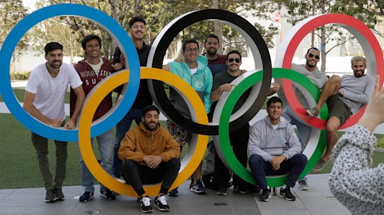Tourists have their photo taken with the Olympic rings in Tokyo at the weekend. 