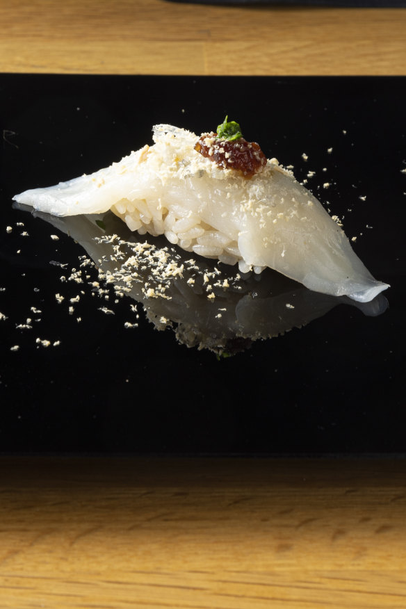Supplementary nigiri of fugu with foie gras shavings.