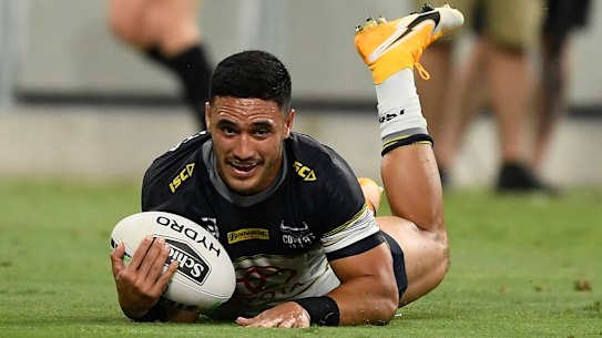 Winners are grinners: Valentine Holmes seals North Queensland's win.