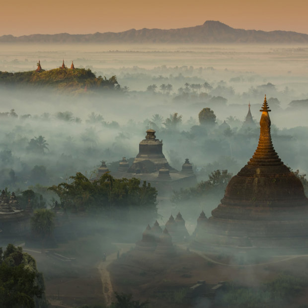 The temples and pagodas of misty Mrauk U, an archeological site in western Burma. Scenes of temples among misty hills are among the sights that had drawn tourists to Myanmar, largely uncharted since colonisation ended.  