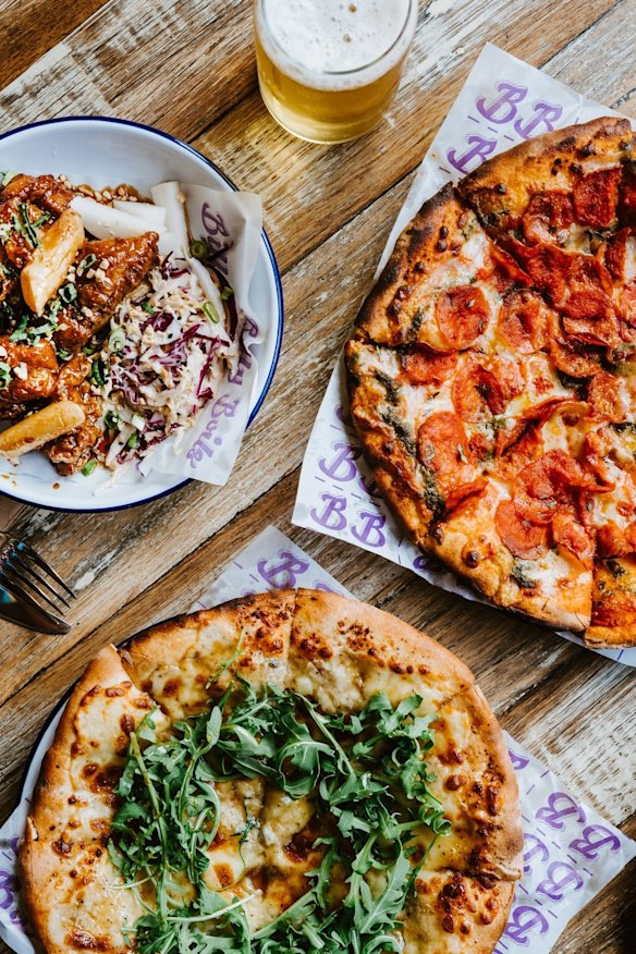 Pepperoni pizza and quattro cheese pizza with rosemary honey and rocket. 