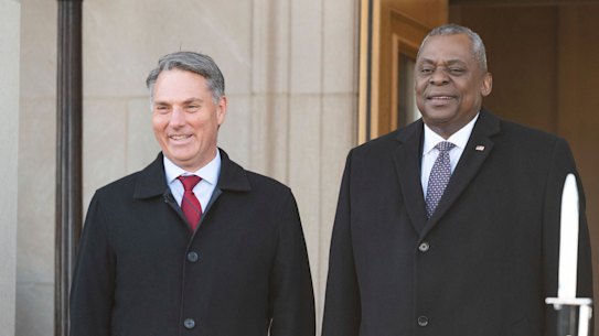 Secretary of Defence Lloyd Austin, centre, welcomes Australian Deputy Prime Minister and Minister of Defense Richard Marles, left, at the Pentagon.