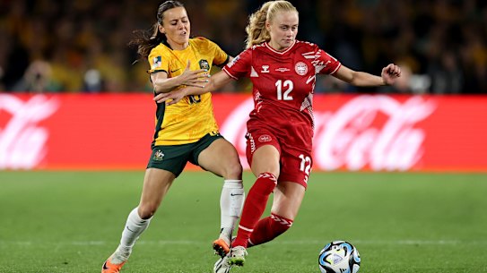 Hayley Raso and Kathrine Kuhle fight for the ball.