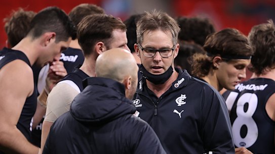 Carlton coach David Teague walks away after talking to his players during the loss to Greater Western Sydney.