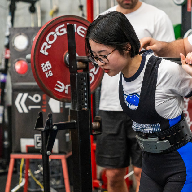 Dori Qu, 22, competing in a recent powerlifting competition.