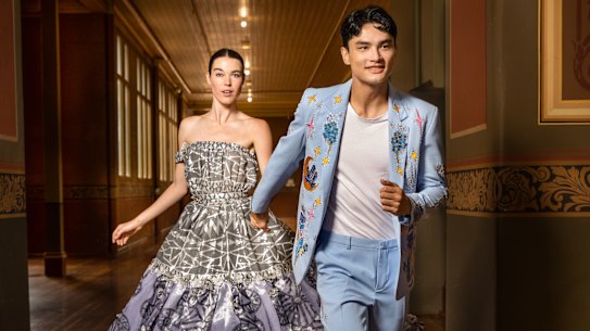 Models Jay Coolahan (wearing Reigner) and Clare Walker (wearing Paul McCann) celebrate the launch of the Melbourne Fashion Festival program.