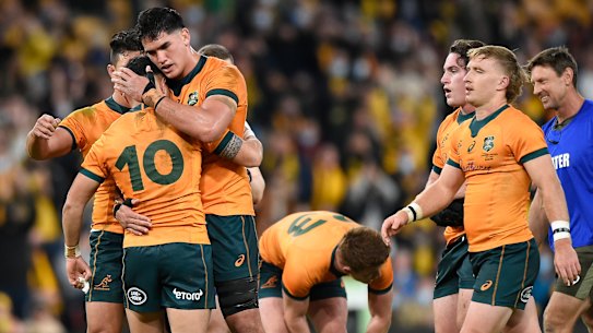 The Wallabies celebrate their after-the-siren win over France in Brisbane.