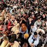 Afghan citizens pack inside a U.S. Air Force C-17 Globemaster III, as they are transported from Hamid Karzai International Airport in Afghanistan, on Aug. 15, 2021.