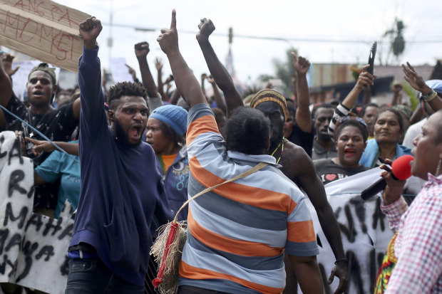 Papuans shout slogans during a protest in Timika, Papua, on August 21.