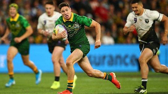 Mitchell Moses bursts into the clear to score a try for Australia in the final on Saturday night.