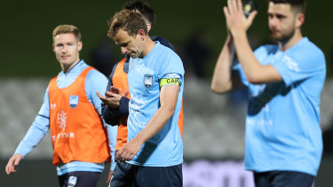 Sydney FC players leave the field after the loss to Macarthur.