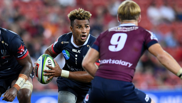 Half and half: Will Genia faces opposite number Tate McDermott of the Reds.