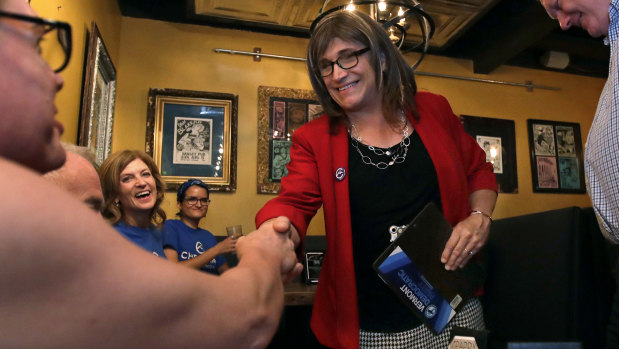 Vermont Democratic gubernatorial candidate Christine Hallquist shakes hands with her supporters during her election night party in Burlington, Vermont.
