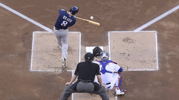 Ryan Braun bats in a run in the first inning against the Dodgers in game three.