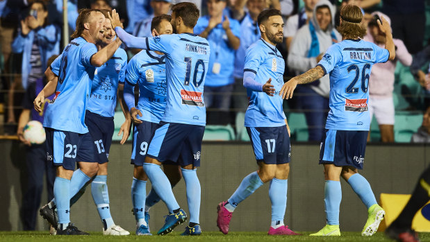Sydney FC celebrate Rhyan Grant's goal in their win over the Phoenix on Sunday. 