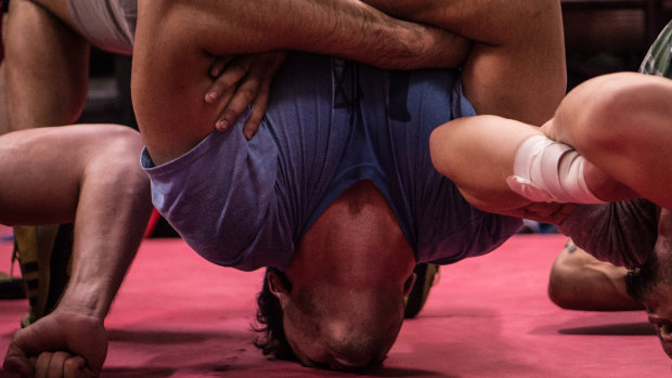 Strong neck, strong mind: Wrestler Ricky South performs a bridge with no hands for support.