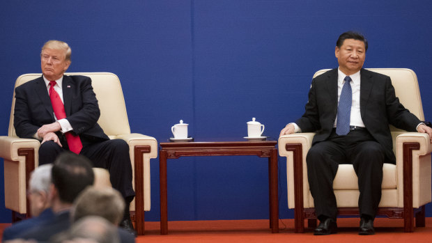 US-Sino trade tensions are playing a role in radio and TV programming in China. Here Donald Trump and Xi Jinping share a stage in Beijing in 2017.