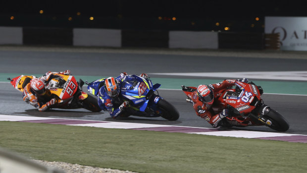 Italian Andrea Dovizioso leads the way during a tight race in the MotoGP season-opener in Qatar.