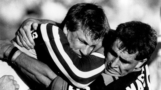 Shane Flanagan tackles Alan McIndoe during his playing days with Western Suburbs.