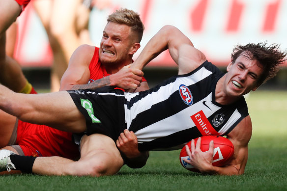 Callum Brown is tackled by Brandon Ellis.