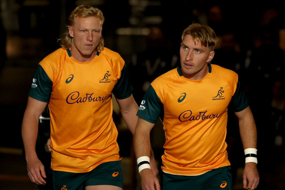 Carter Gordon and Tate McDermott walk onto the MCG.