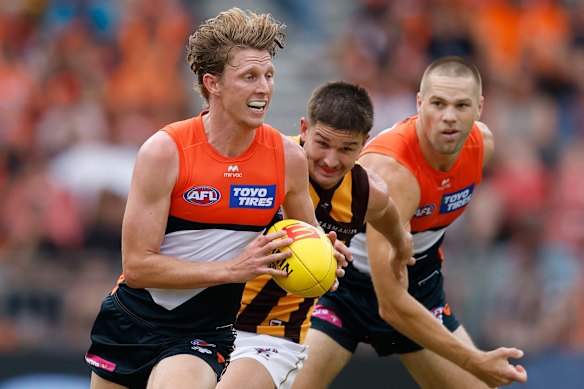 On the run: Giants playmaker Lachie Whitfield.