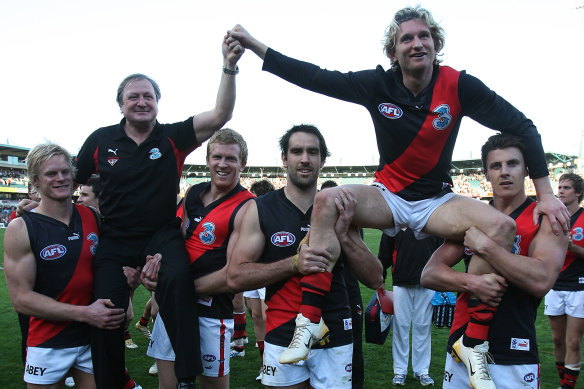 Sheedy and James Hird are chaired off the ground after their last games as Essendon coach and player, respectively, in 2007.