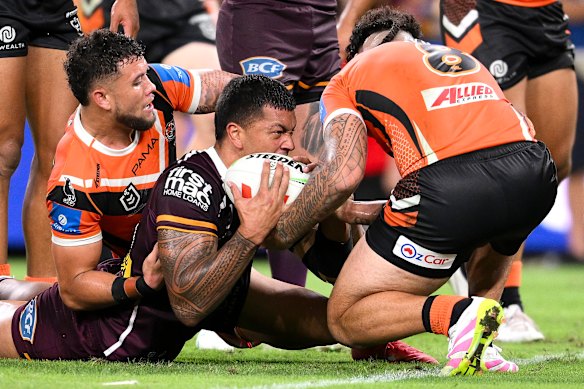 Xavier Willison reaches out to score for the Brisbane Broncos against Wests Tigers.