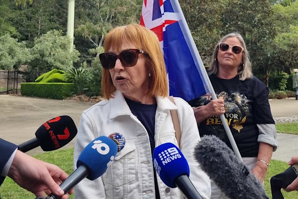 Supporters speak to media.