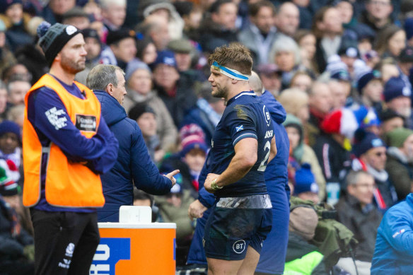 Scotland’s George Turner leaves the field for an HIA during the Six Nations match against France on Sunday (AEDT).