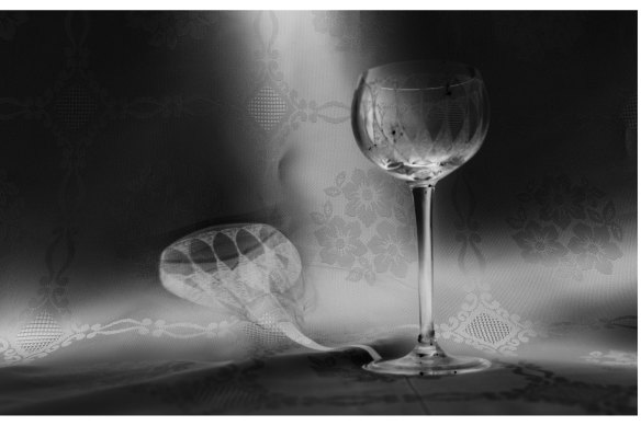 Glass shadow on embroidery: an image from In My Mother’s House, Nocturnes