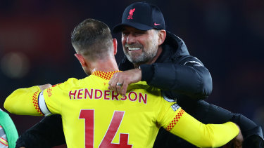 Juergen Klopp and Jordan Henderson celebrate Liverpool’s 2-1 win over Southampton.