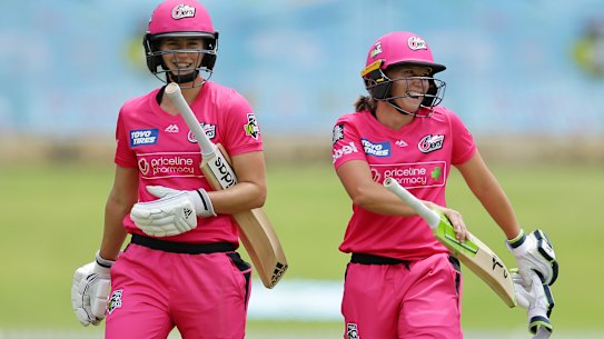 Ellyse Perry and Alyssa Healy laugh their way off the field after their incredible innings. 