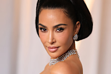 Kim Kardashian reportedly blindsided her mum by including details of her alleged affair in a book.