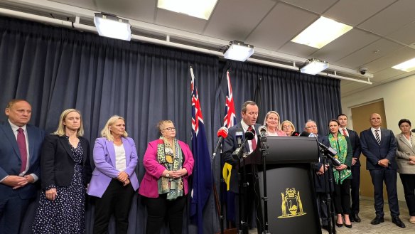 Premier Mark McGowan, flanked by his ministers, announced he was quitting politics on Monday. 